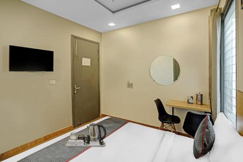 Μια τηλεόραση ή/και κέντρο ψυχαγωγίας στο Super Townhouse Mannat Rohini 16