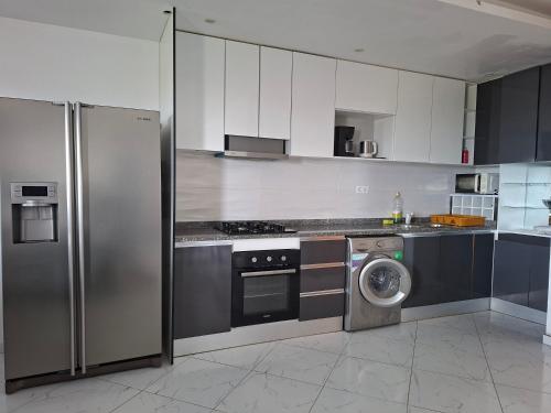 Kuchyň nebo kuchyňský kout v ubytování Figo Apartamentos