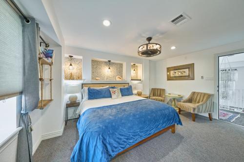 a bedroom with a bed and a table and chairs at Houston Towers Inn, Adults-Only, Downtown, Med Ctr, NRG in Houston