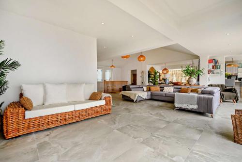 a living room with two couches and a couch at Sandpipers - Downderry in Downderry