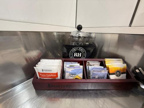 a box of food sitting on top of a refrigerator at Admirals Motor Inn in Nelson