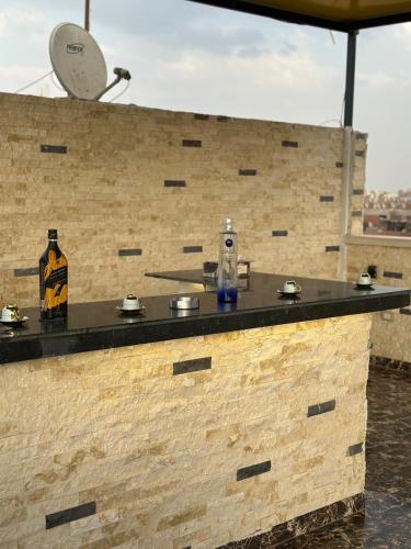 a stone counter with a clock on a brick wall at king pyramids in Cairo