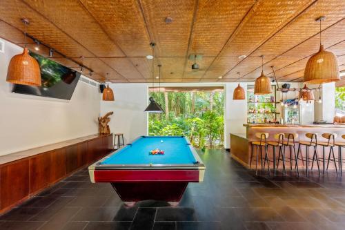 a pool table in a room with a bar at Hoi An Eco Lodge & Spa in Hoi An