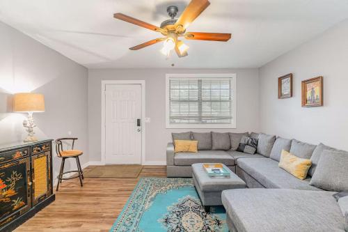 a living room with a couch and a ceiling fan at Cute & Cozy - Minutes from Downtown & BNA in Nashville