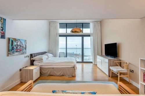 Ένα ή περισσότερα κρεβάτια σε δωμάτιο στο The Penthouse - Hythe