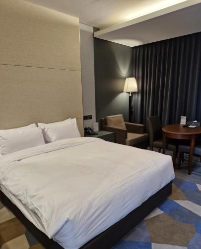 Postel nebo postele na pokoji v ubytování Niagara Hotel