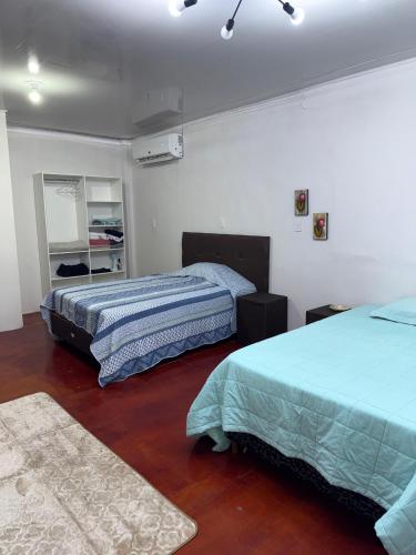 Postel nebo postele na pokoji v ubytování Loft Premiun San Isidro