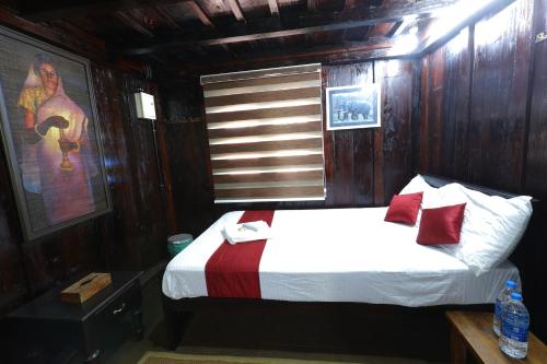 a bedroom with a bed in a wooden room at Castillo De Woods , The Private Luxury Villa , 8 BHK, Vattavada in Kottakamboor