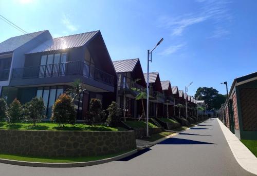 a row of houses on a street at Wind Hill Mountain View Resort in Gununggeulis