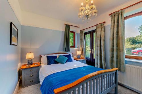a bedroom with a bed and a window at Willow House - Dymchurch in Dymchurch