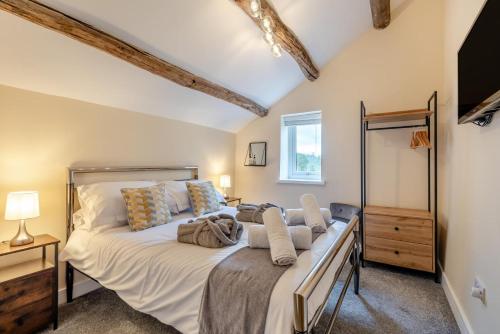 a bedroom with a large bed in a room at Isel Gate Cottage in Sunderland