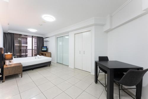 Ένα ή περισσότερα κρεβάτια σε δωμάτιο στο Fiori Apartments