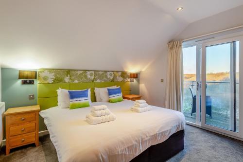 Postel nebo postele na pokoji v ubytování Cwtch- Retallack