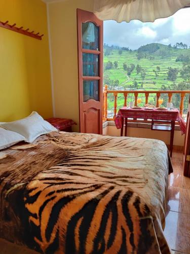 Ένα ή περισσότερα κρεβάτια σε δωμάτιο στο Hotel Tambo del Inca