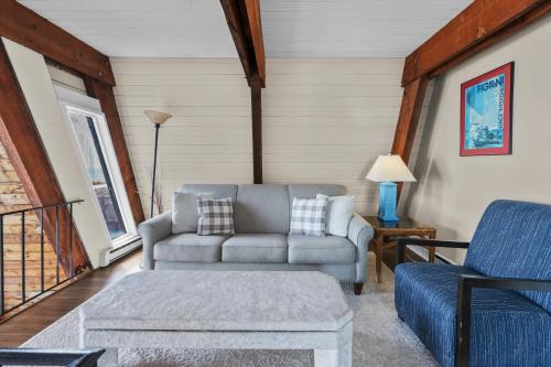 a living room with a couch and a chair at Hydrangeas by the Sea in Barnstable