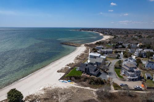 an aerial view of a beach with houses and the ocean at Hydrangeas by the Sea in Barnstable