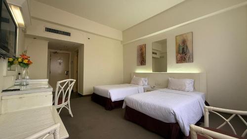 Postel nebo postele na pokoji v ubytování De Palma Hotel Ampang