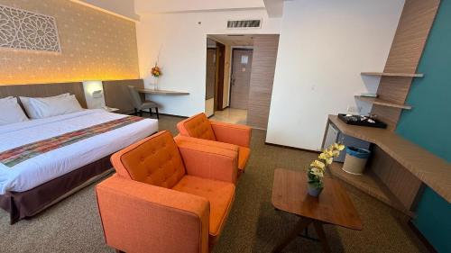 Postel nebo postele na pokoji v ubytování De Palma Hotel Ampang