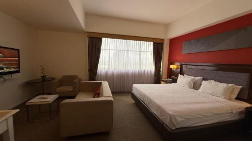 Postel nebo postele na pokoji v ubytování De Palma Hotel Ampang