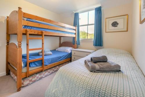 Voodi või voodid majutusasutuse Cherry Tree Cottage toas