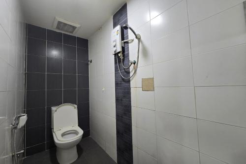 a bathroom with a toilet and a shower at Fast Hotel Sri Gombak in Batu Caves