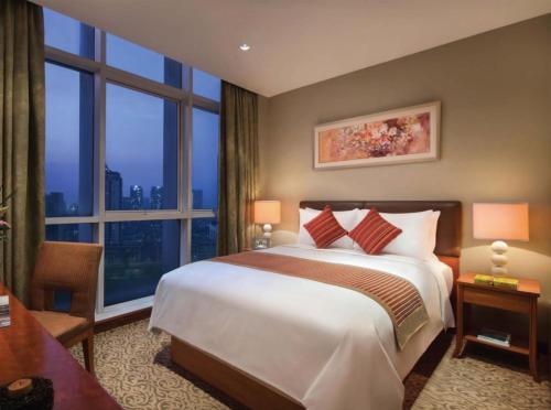 Katil atau katil-katil dalam bilik di Oakwood Premier Cozmo Jakarta