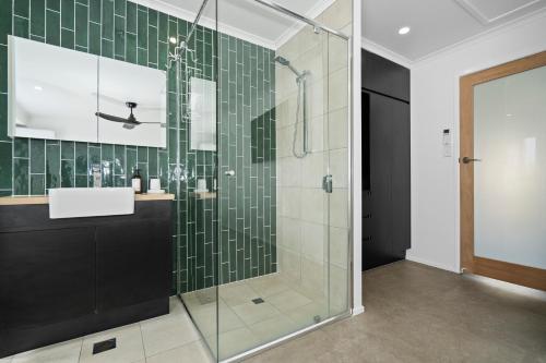 a bathroom with a glass shower and a sink at Studio Four 