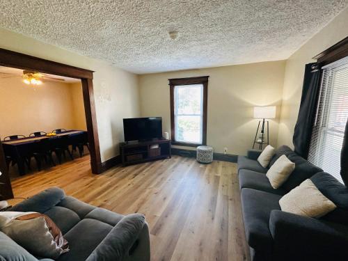 a living room with a couch and a table at Charming 4BR Westside Home in Beer City USA in Grand Rapids