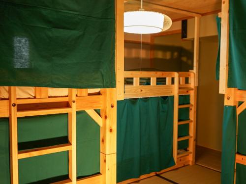 a bunk bed room with two bunk beds at ECO inn in Inazawa