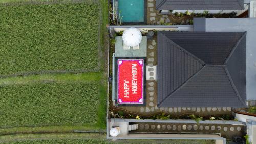 an overhead view of a building with a red sign at Mahayani Ubud Villa in Tegalalang