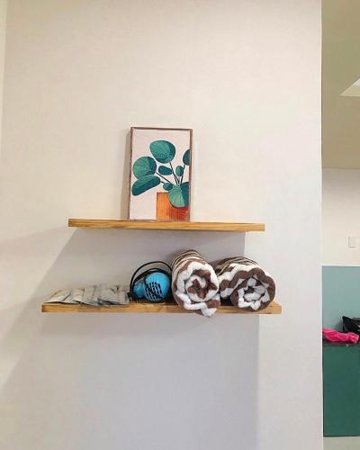a shelf with a picture and some stuffed animals on it at An's House In Phan Rang in Kinh Dinh