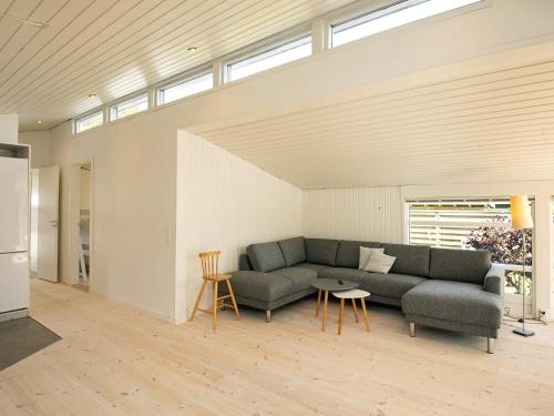 a living room with a couch and a table at 8 person holiday home in Hals in Hals