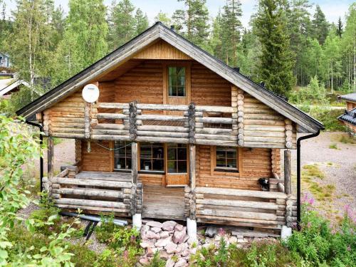 a log cabin in the middle of a forest at 7 person holiday home in SÄLEN-By Traum in Tandådalen