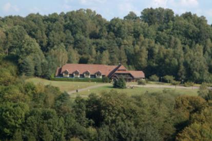 a large house in the middle of a forest at Le Relais Des Chateaux Forts in Bitche