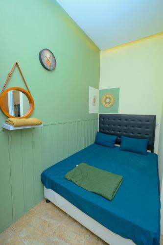 Katil atau katil-katil dalam bilik di Satoe Atap Rooms