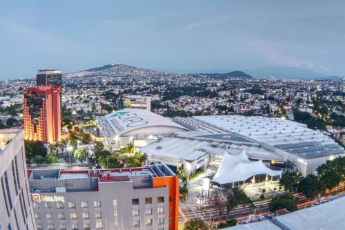 an aerial view of a city with a building at Expo GDL 2 Min Executive Style and Comfort in Guadalajara