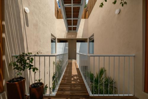 a staircase in a building with plants at Cholula Condesa Hotel by Lumina in Mexico City