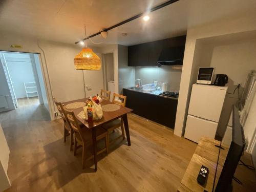 a kitchen and dining room with a table and chairs at Rusutsu Golf&Ski Lodge - Vacation STAY 18169 in Rusutsu