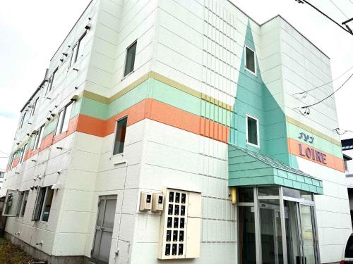 a building with a rainbow colored at Maison Loire - Vacation STAY 18226 in Hakodate