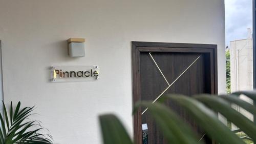a door with a sign that reads plunge on it at Tranquil Touch in Chikmagalūr