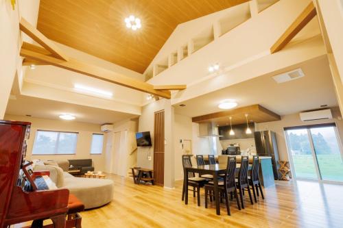 a living room and dining room with a table and chairs at Variety Road Bette Gento - Vacation STAY 83175v in Kawasaki