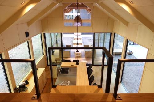 a view of a kitchen and dining room of a tiny house at and FOREST Katsuura Take no Hanare - Vacation STAY 91561v in Katsuura
