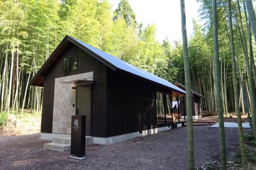 a small building in the middle of a forest at and FOREST Katsuura Take no Hanare - Vacation STAY 91561v in Katsuura
