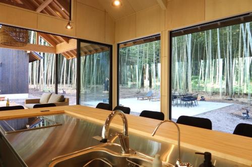 a kitchen with a sink and a large window at and FOREST Katsuura Take no Hanare - Vacation STAY 91561v in Katsuura