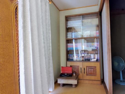 a room with a book shelf with a laptop on a table at Yoshinogawa - House - Vacation STAY 98531v in Yoshinogawa
