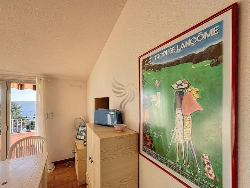 a picture of a room with a poster on the wall at Panoramic Levant view–4 ppl–Sea–Pool–Tennis in Saint-Raphaël