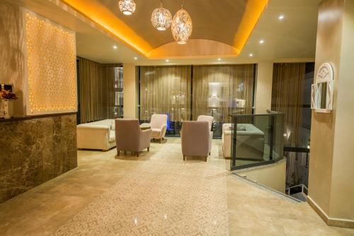 a salon with chairs and a waiting room at Montebello Deluxe Hotel in Oludeniz