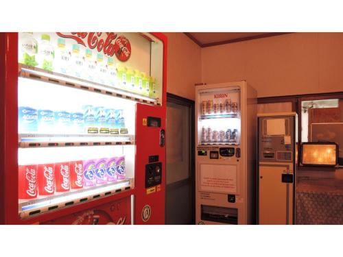 a drink vending machine next to a soda machine at Shintaku Sanso - Vacation STAY 27204v in Kunizakai