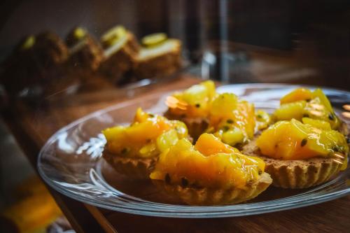 a plate of food on a wooden table at Zanzibar Coffee House in Zanzibar City