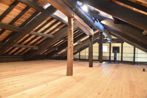an attic room with wooden floors and wooden beams at Morinoyado38 - Vacation STAY 18457 in Shizuoka